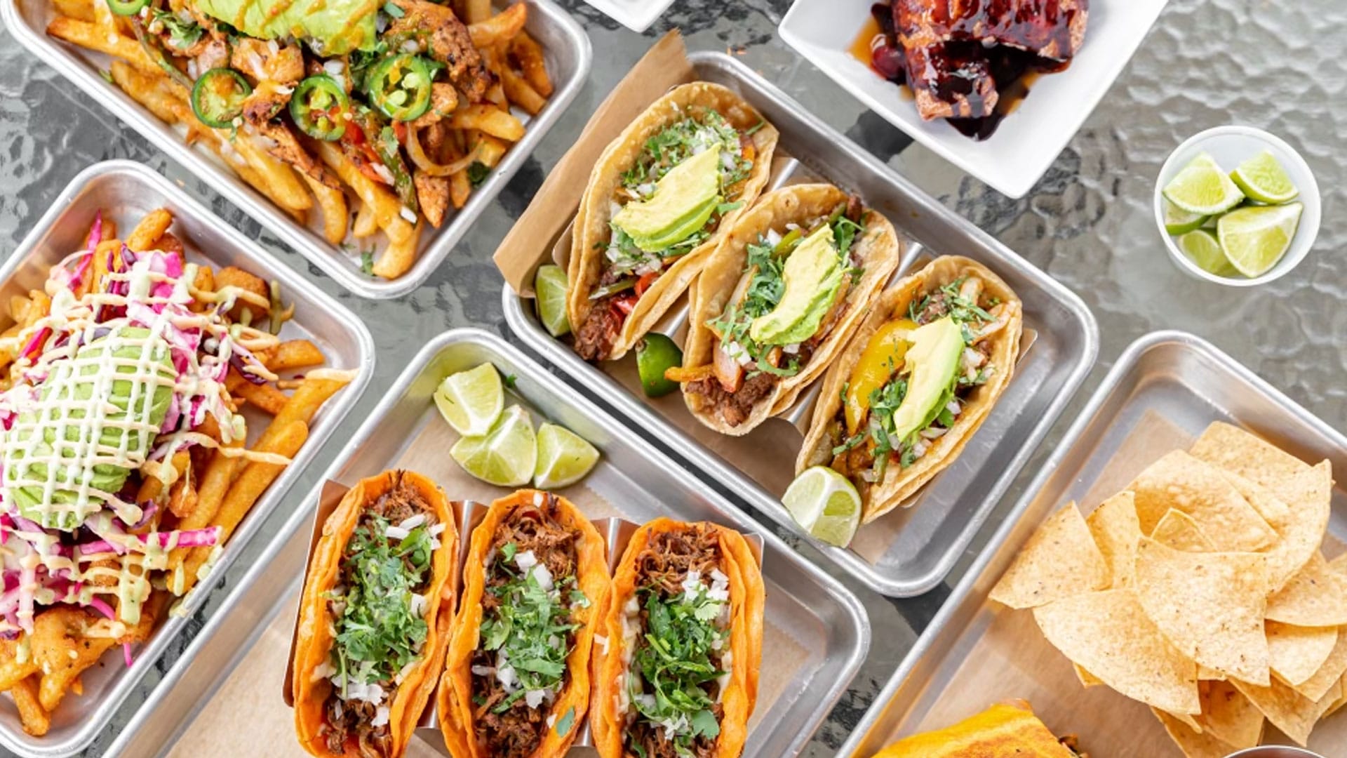 Street Tacos served at Atwater Street Tacos in Monroe, Michigan — carne asada, carnitas, al pastor, and grilled shrimp on corn tortillas with cilantro and onions.