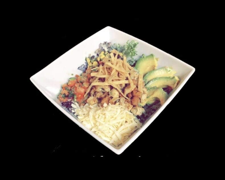 Flavorful Ensalada from Atwater Street Tacos with grilled meat, mixed greens, cheese, pico de gallo, corn relish, avocado, tortilla strips, and cilantro lime ranch dressing.