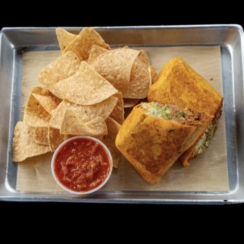 Big Ole Burrito with jalapeño cheddar tortilla, loaded with steak, chicken, veggies, and served with chips and salsa at Atwater Street Tacos in Monroe and Flat Rock, MI