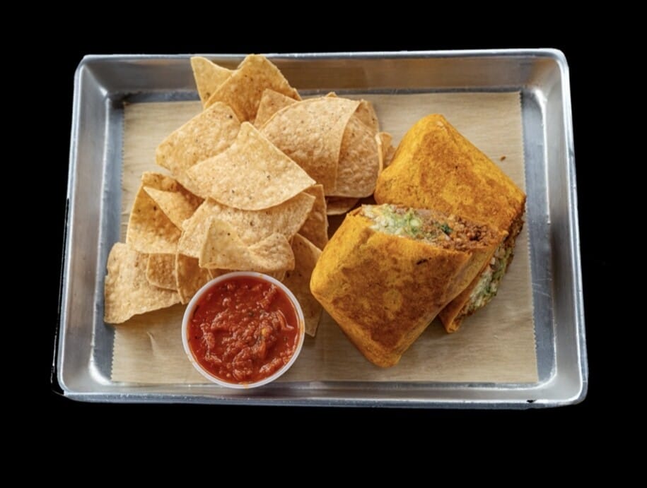 Big Ole Burrito with jalapeño cheddar tortilla, loaded with steak, chicken, veggies, and served with chips and salsa at Atwater Street Tacos in Monroe and Flat Rock, MI