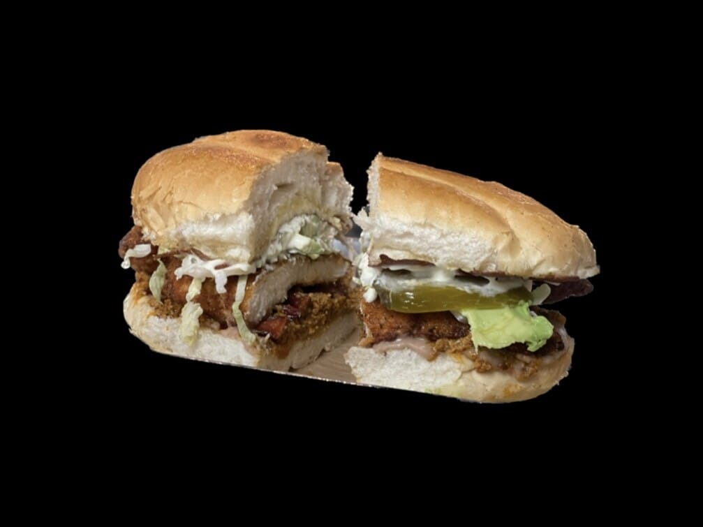 Image of a Torta 3 Meat from Atwater Street Tacos, featuring soft telera bread filled with refried beans, lettuce, tomato, avocado, onion, jalapeno, and succulent meats. Customizable with optional extras.